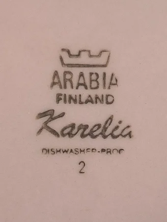 Brown stamped mark with crown, ARABIA, FINLAND, Karelia in script, and DISHWASHER-PROOF