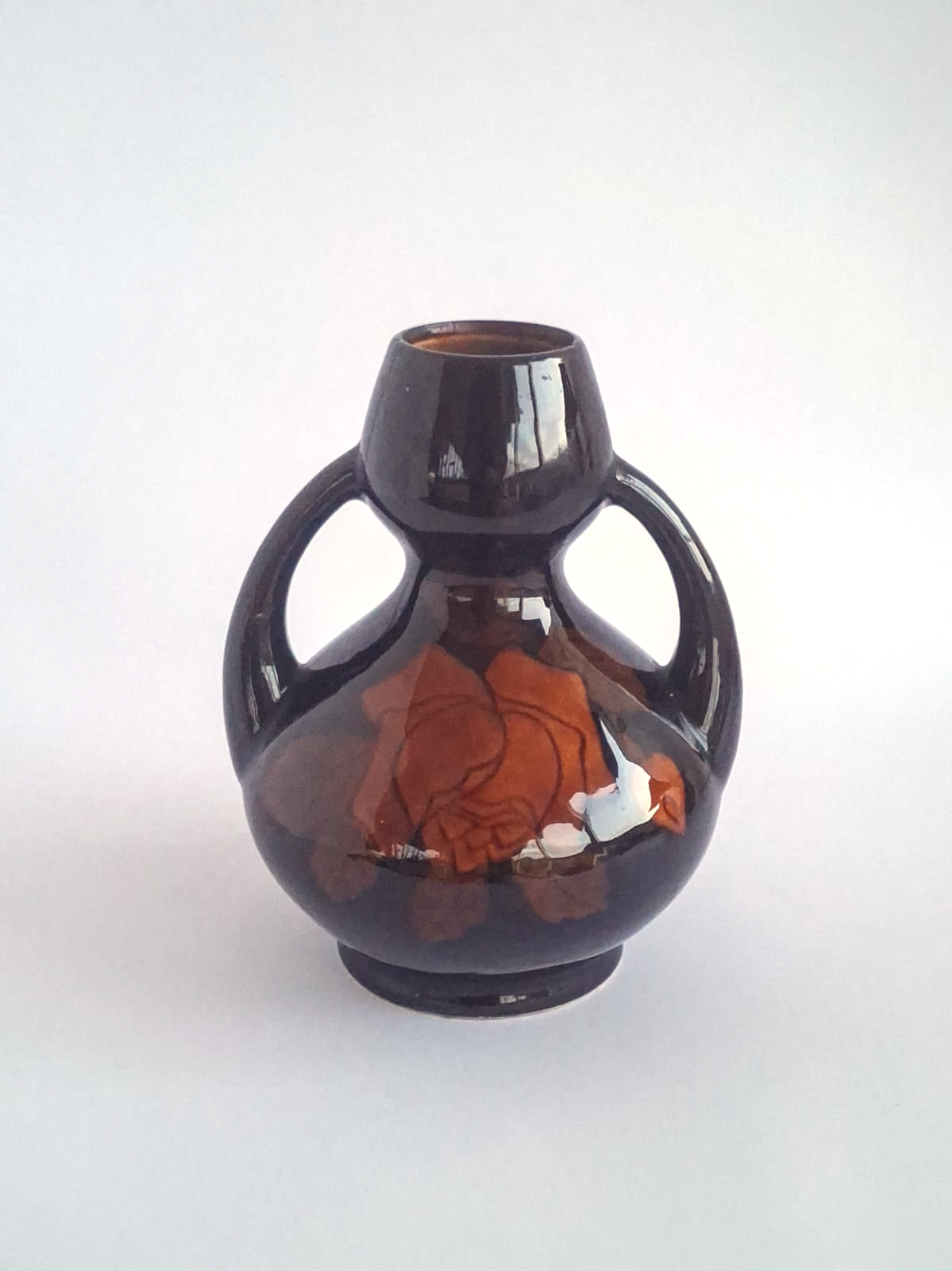 Black amphora vase with roses