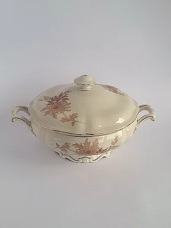 Cream porcelain lidded soup terrine with two handles, decorated with beige and pink floral sprays and gold trim