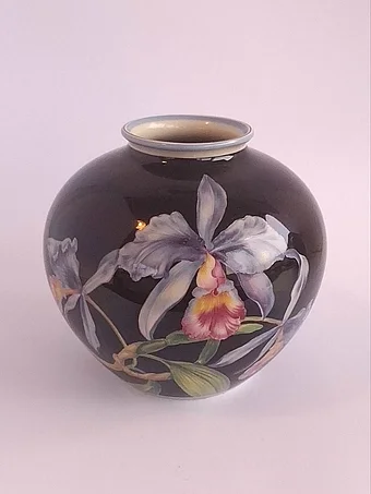 Spherical black porcelain vase with handpainted Cattleya orchids in lavender, pink, yellow and green